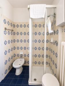 a bathroom with a shower and a toilet and a sink at Albergo dell'Angelo in Pieve di Teco +148 photos