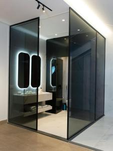 a large mirror in a bathroom with a sink at Arados Resort in Bdibbā +32 photos