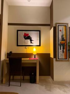 a dining room with a table with a lamp on it at Private & Serene Golf View Apt Phase 7 in Rawalpindi