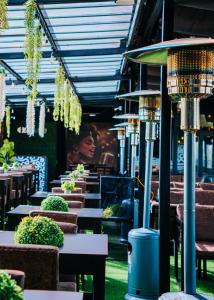 a row of tables and chairs in a restaurant at The Ace Hotel in Lusaka
