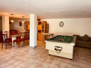 a living room with a pool table in it at Villa Horta in Horta