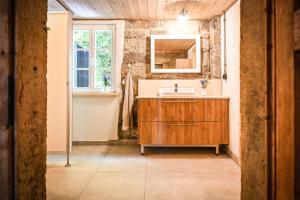 a bathroom with a sink and a mirror at Berghof Papstdorf in Kurort Gohrisch