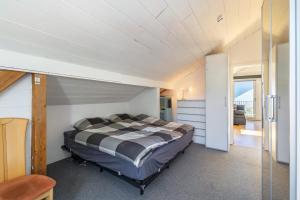 a bedroom with a bed in a room at Panoramablick Loft & Aktiv-Urlaub in Lichtenstein +27 photos