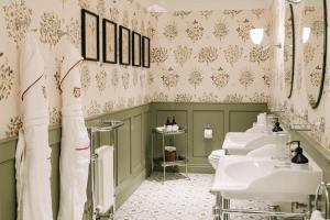 a bathroom with two sinks and two toilets at Cromlix in Kinbuck +88 photos