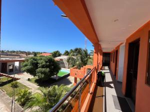 a balcony with a view of a pool at Hotel Residencial Assamar in Pemba +6 photos
