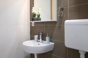 a bathroom with a sink and a toilet at Doricera in Kotor