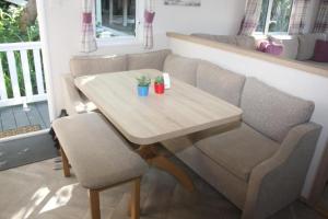 a table and two chairs in a room at Beauport Retreat in Hastings +4 photos