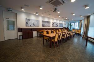 a conference room with a table and chairs at Hotel Senimo in Olomouc