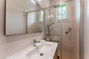 a bathroom with a sink and a shower at Maison de Charme in Mimizan-Plage +16 photos