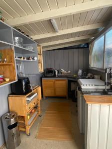a kitchen with a counter and a stove in it at Maria Vendéghaz in Mernye