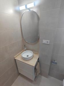 a bathroom with a sink and a mirror at El Sol de la Paz in Haro +10 photos