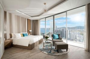 a bedroom with a bed and a large window at Panorama Beach Win Nha Trang in Nha Trang +65 photos