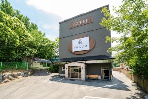 a hotel with a sign on the side of a building at Hotel Traum in Gapyeong