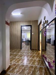 an empty hallway with a room with a table at Hypnotic Suite 1 in Piteşti