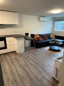 a living room with a couch and a table at Cozy apartment in Tananger close to the Airport in Tananger