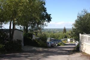 a house with a car parked in a driveway at Beauport Retreat in Hastings