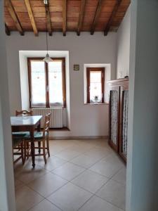 a kitchen and dining room with a table and chairs at Martini River House in Barberino di Mugello +44 photos