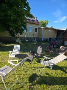 a group of chairs and a table in a yard at Seaside Koster house in Strömstad