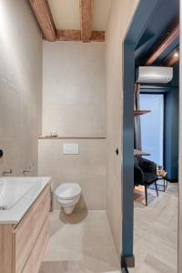 a bathroom with a toilet and a sink at Boutique Hotel Alkmaar - City Rooms & Apartments in Alkmaar +60 photos
