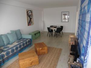 a living room with a couch and a table at Vilamar - Ribamar in Ribamar