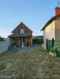 a house with a large yard in front of it at Chrisme in Saint-Hilaire-Fontaine +9 photos