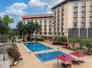 an overhead view of a hotel with a swimming pool at Radisson Blu Dhaka Water Garden in Dhaka