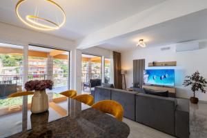 a living room with a couch and a table at Apartment Jakov Grscica in Prizba