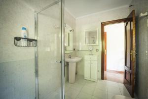 a bathroom with a shower and a sink at Casa Rural El FerJo in Colunga +51 photos