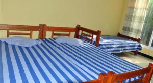 Voodi või voodid majutusasutuse Hotel Pearl Gate toas