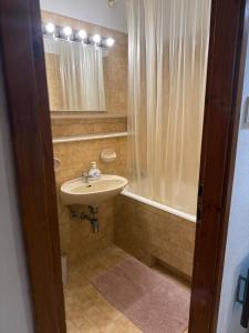 a bathroom with a sink and a shower at Green Quiet Apartments in Vodice +29 photos
