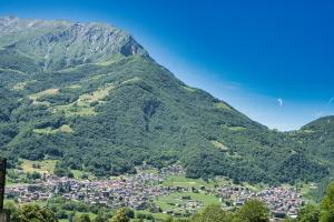 a town in a valley in the mountains at Alpine studio Barzio in Barzio