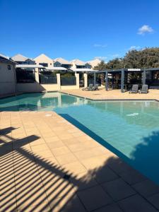 a swimming pool on top of a building at Beach Studio with Ocean View in Gnarabup