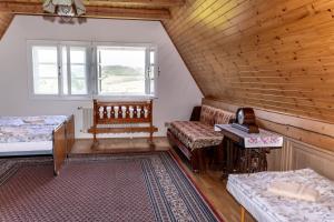 a room with a couch and a bed and a window at Vila Vlasta in Bruntál +104 photos