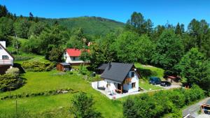 an aerial view of a house on a hill at Domek Pod Lasem in Lipowa