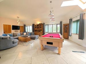 a living room with a pool table in it at 5 Bed in Garth oc-c44957 in Garth