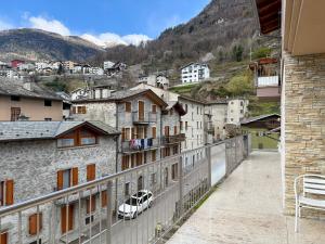 a view of a city with a car on a balcony at La Terrazza di Gino in Grosio