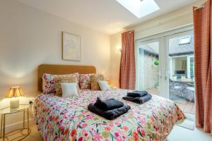 a bedroom with a bed with towels on it at 2 Bed in Buxted oc-t44744 in Buxted