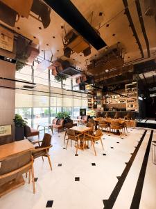 a restaurant with tables and chairs and windows at Cityloft 175 in Istanbul