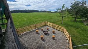 an aerial view of a fire pit in a field at Mutzgraben Lodge in Seeberg +3 photos