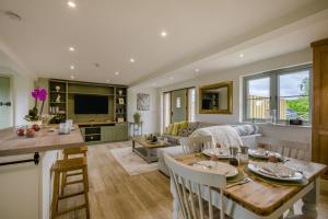 a kitchen and living room with a table and a couch at 2 Bed in Docking oc-t44851 in Docking