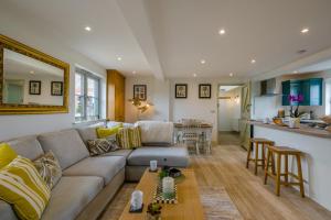 a living room with a couch and a kitchen at 2 Bed in Docking oc-t44851 in Docking +14 photos