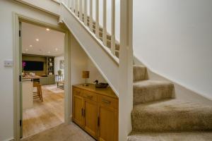 a staircase leading up to a living room with a stair case at 2 Bed in Docking oc-t44851 in Docking