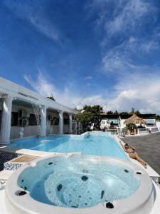 a large swimming pool with a hot tub at Hotel Chopin in Fiumicino