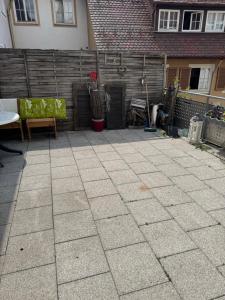 a patio with some chairs and a fence at Marivel Wohnung in Freudenstadt