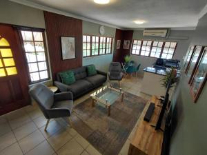 a living room with a couch and a table at Executive Flat with Stunning Views in Westville