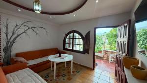 a living room with a couch and a table at Dar YLA in Tétouan
