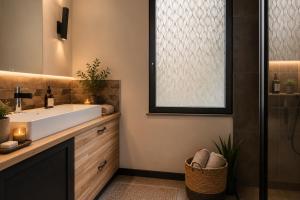 a bathroom with a sink and a shower at Villa Confidentielle Opale in Merlimont +9 photos