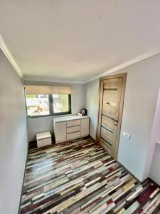 an empty room with a rug on the floor at Hayq in Yerevan