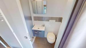 a small bathroom with a toilet and a mirror at HÔTEL Relais de Monti in Menton +22 photos