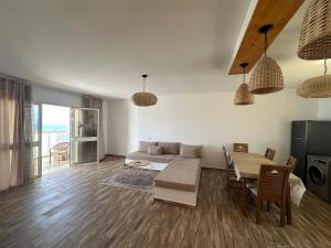 a living room with a couch and a table at Diar Jabal Villa S2 in Banī ‘Aţāʼ
